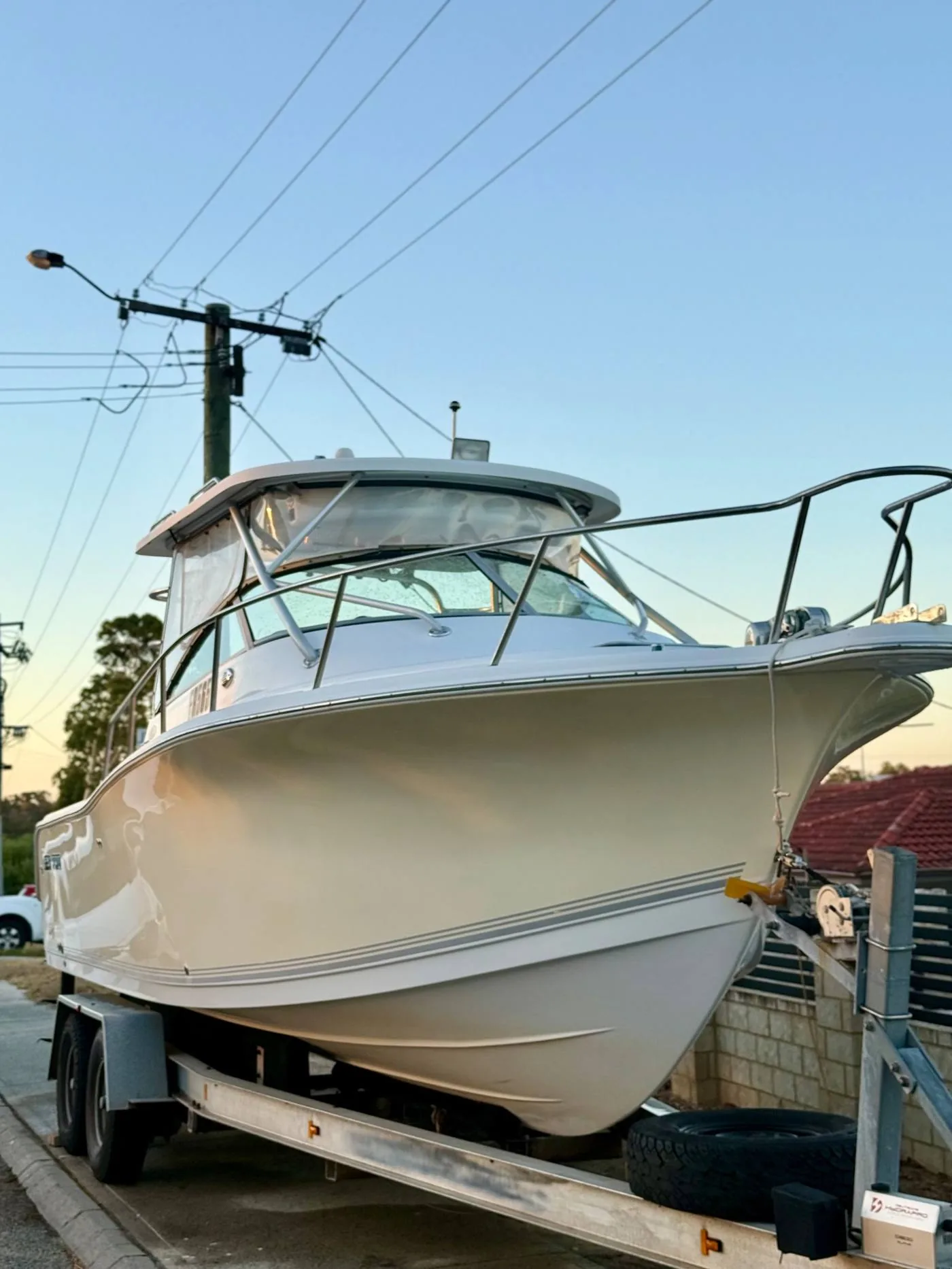 Cabin cruiser boat detailing Perth — full exterior detail at sunset